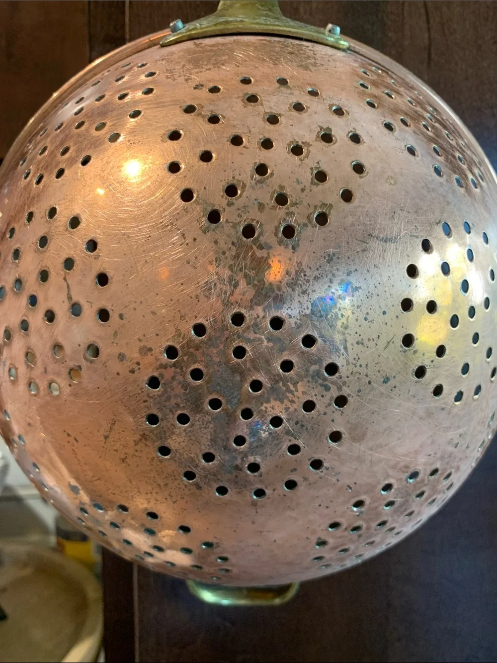 vintage copper colander strainer with a long brass handle 16”L